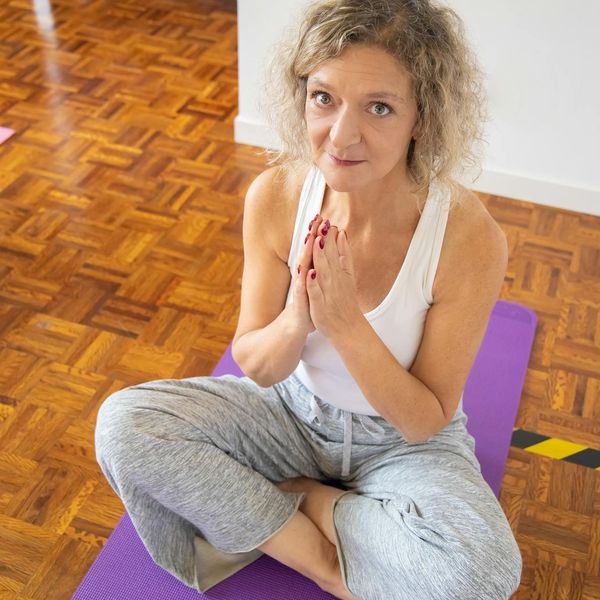 Person stretching gently, showing flexibility and calm.